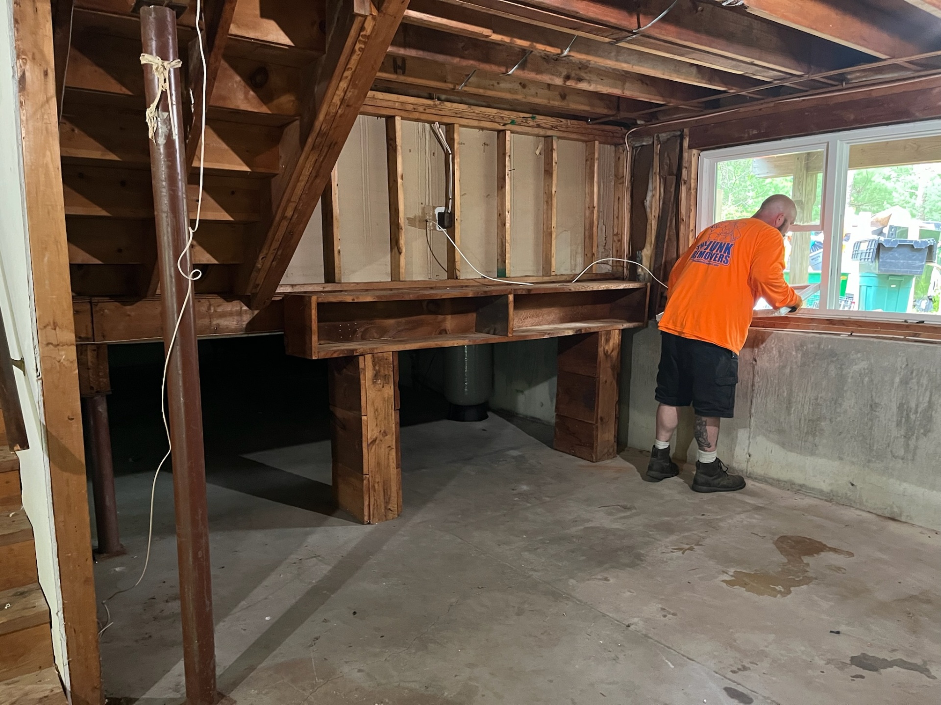 Team member clearing out a basement