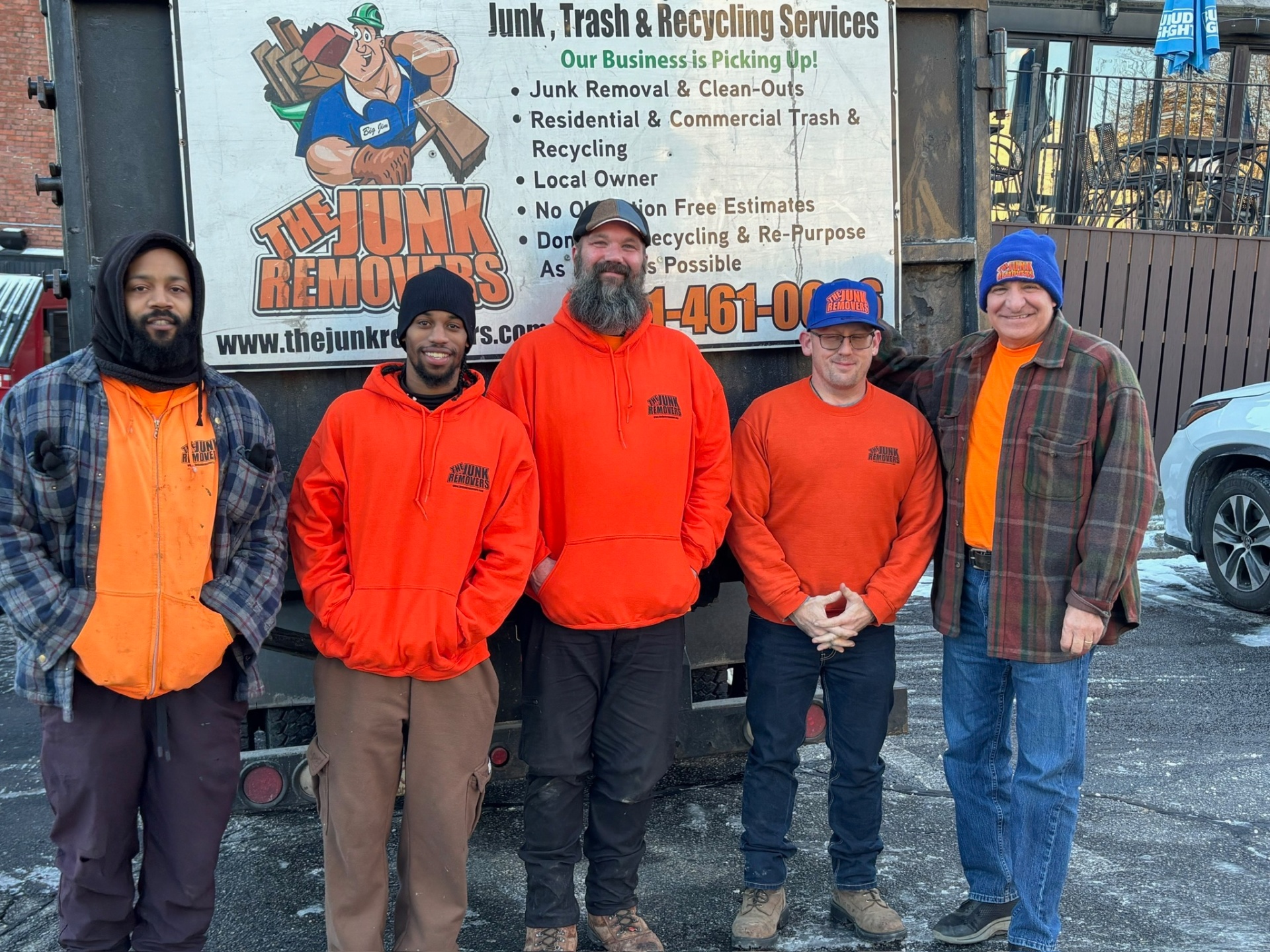 The Junk Removers crew group photo in front of the truck